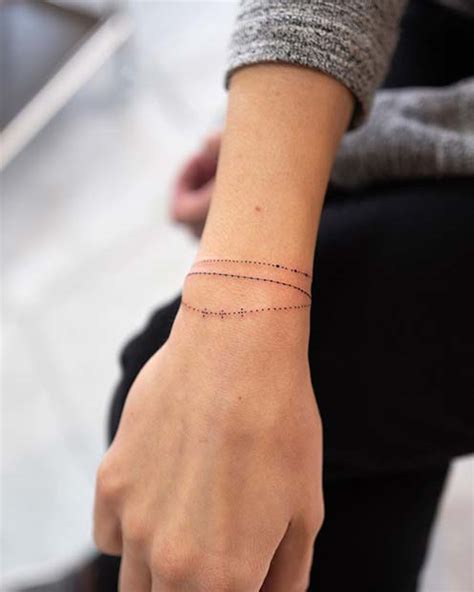 braclet tattoo|tattoos that look like bracelets.